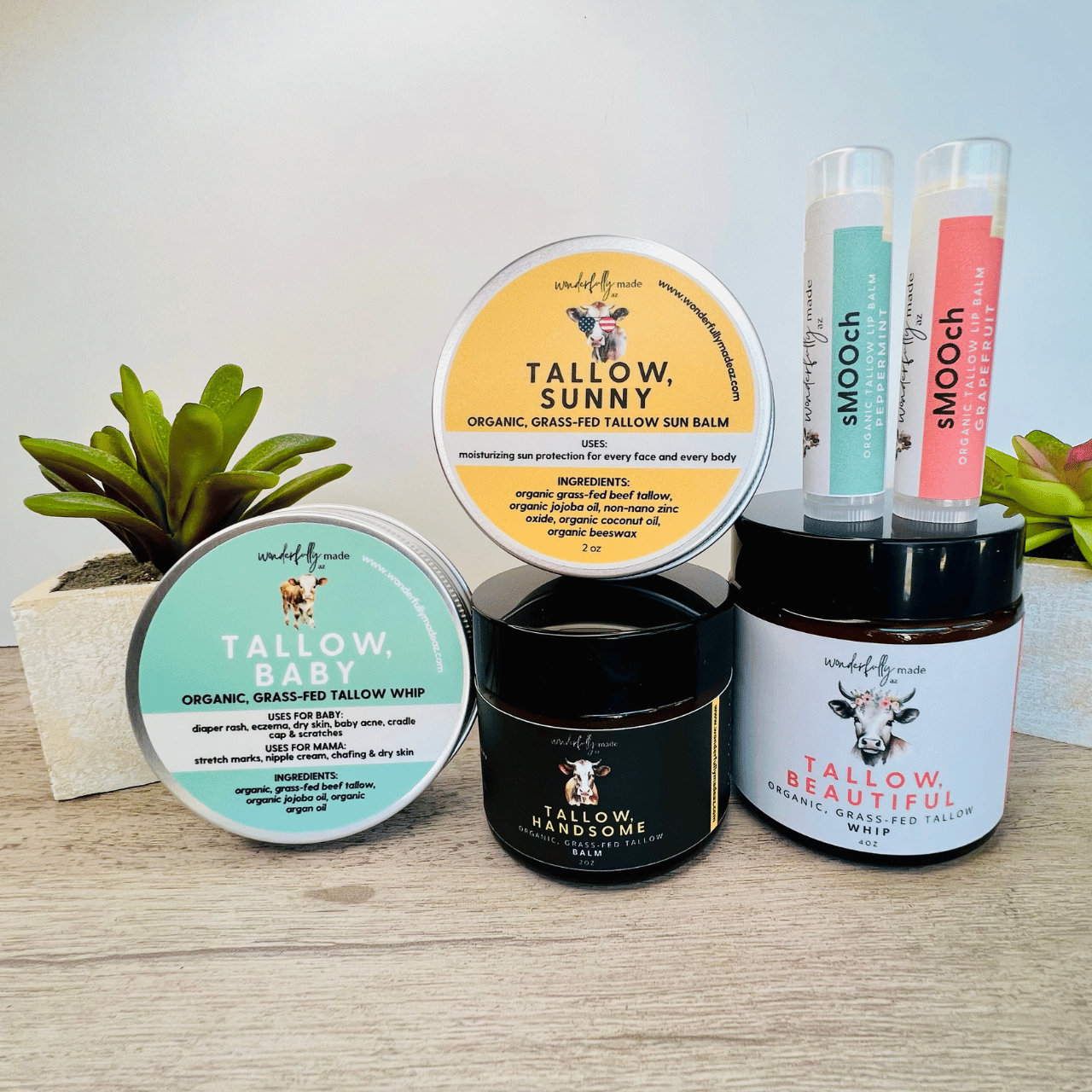 All Tallow Products on wood surface with plants in background